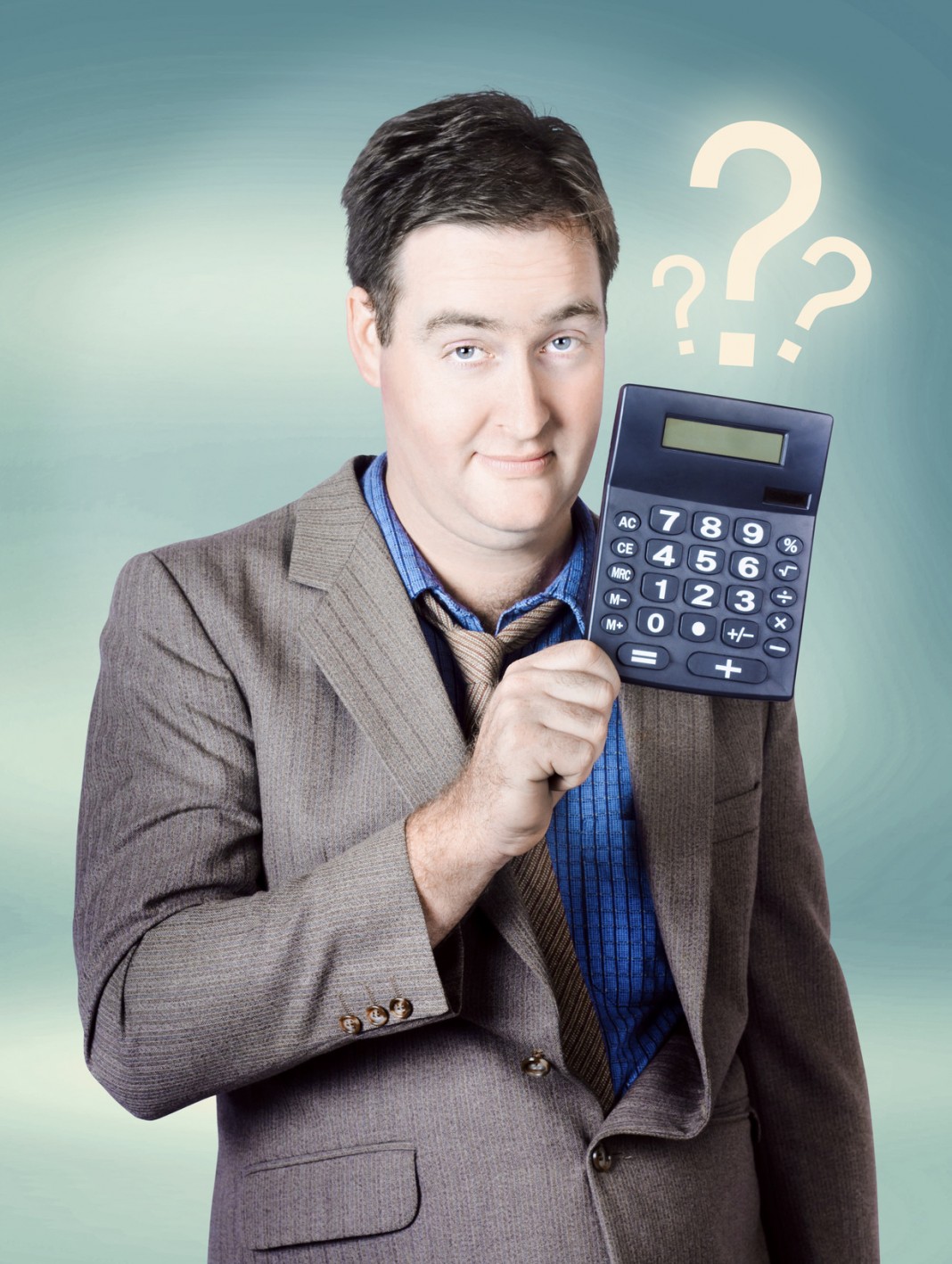Business man holding calculator. Money question