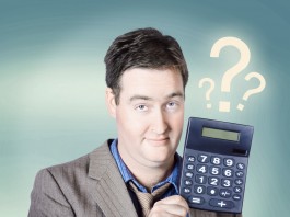 Business man holding calculator. Money question