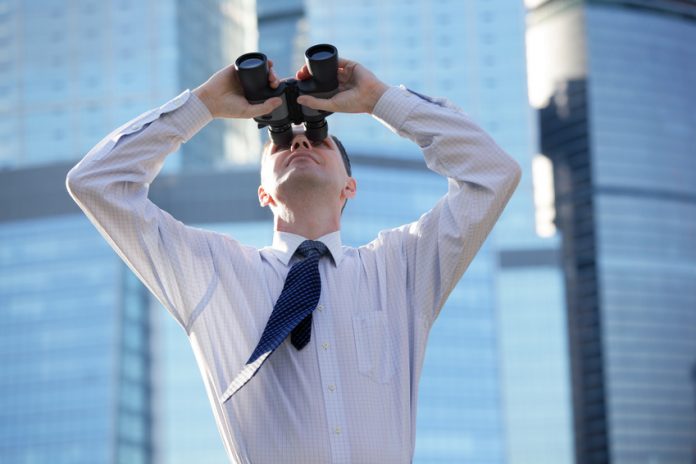 Businessman with binoculars