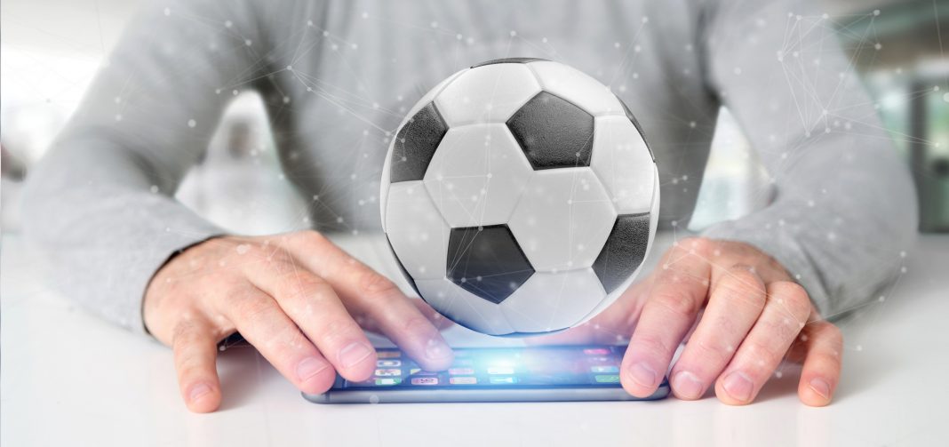 Man holding a Football ball and connection isolated 3d rendering