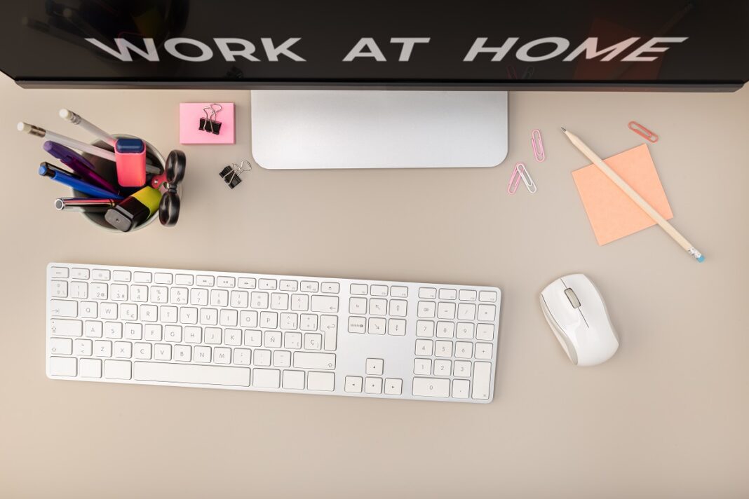 Work at home concept. Top View of Workspace with a computer and office supplies. Flat lay office desk. Copy space