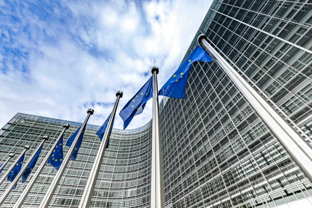 european union blue and gold flags flying in brussels, belgium